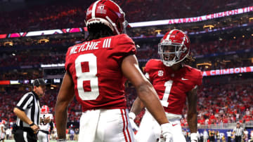 ATLANTA, GEORGIA - DECEMBER 04: John Metchie III #8 of the Alabama Crimson Tide reacts after scoring a touchdown with teammate Jameson Williams #1 in the second quarter of the SEC Championship game against the Georgia Bulldogs at Mercedes-Benz Stadium on December 04, 2021 in Atlanta, Georgia. (Photo by Kevin C. Cox/Getty Images)