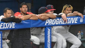 Jun 30, 2021; Cleveland, Ohio, USA; Cleveland Indians third baseman Jose Ramirez (right) watches from the dugout against the Detroit Tigers at Progressive Field. Mandatory Credit: David Richard-USA TODAY Sports