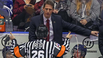 MISSISSAUGA, ON - NOVEMBER 27: Coach Kris Knoblauch of the Erie Otters gets an explanation of a call for the referee during OHL game action on November 27, 2015 at the Hershey Centre in Mississauga, Ontario, Canada. (Photo by Graig Abel/Getty Images)