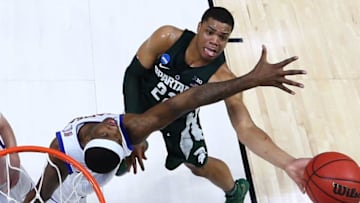 TULSA, OK - MARCH 19: Miles Bridges #22 of the Michigan State Spartans takes a shot against Carlton Bragg Jr. #15 of the Kansas Jayhawks during the second round of the 2017 NCAA Men's Basketball Tournament at BOK Center on March 19, 2017 in Tulsa, Oklahoma. (Photo by Ronald Martinez/Getty Images)