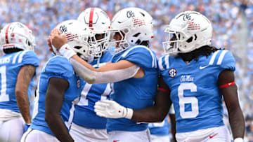 Oct 15, 2022; Oxford, Mississippi, USA; Mississippi Rebels wide receiver Dayton Wade (19) reacts with quarterback Jaxson Dart (2) and running back Zach Evans (6) after a touchdown against the Auburn Tigers during the first quarter at Vaught-Hemingway Stadium. Mandatory Credit: Matt Bush-USA TODAY Sports