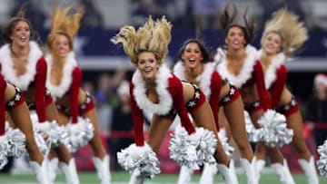 ARLINGTON, TX - DECEMBER 24: The Dallas Cowboys Cheerleaders perform during halftime as the Dallas Cowboys take on the Seattle Seahawks at AT