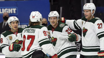 LOS ANGELES, CALIFORNIA - JANUARY 14: Jonas Brodin #25 of the Minnesota Wild celebrates his goal with Jared Spurgeon #46, Kirill Kaprizov #97 and Nick Bjugstad #27 of the Minnesota Wild, to take a 1-0 lead, during the first period in the season opening game at Staples Center on January 14, 2021 in Los Angeles, California. (Photo by Harry How/Getty Images)