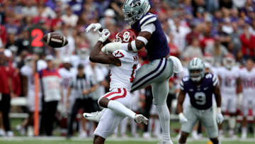 Oct 2, 2021; Manhattan, Kansas, USA; Kansas State Wildcats defensive back Reggie Stubblefield (1) breaks up a pass intended for Oklahoma Sooners wide receiver Marvin Mims (17) during the second quarter of a game at Bill Snyder Family Football Stadium. Mandatory Credit: Scott Sewell-USA TODAY Sports