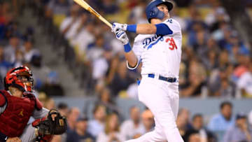LOS ANGELES, CA - AUGUST 22: Joc Pederson #31 of the Los Angeles Dodgers hits a solo homerun in front of Yadier Molina #4 of the St. Louis Cardinals to take a 1-0 lead during the sixth inning at Dodger Stadium on August 22, 2018 in Los Angeles, California. (Photo by Harry How/Getty Images)