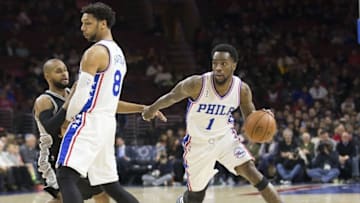 Dec 7, 2015; Philadelphia, PA, USA; Philadelphia 76ers guard Tony Wroten (1) dribbles past center Jahlil Okafor