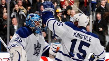 TORONTO, CANADA - DECEMBER 4: Jean-Sebastien Giguere #35 and Tomas Kaberle #15 of the Toronto Maple Leafs celebrate shoot-out win against the Boston Bruins during game action at the Air Canada Centre December 4, 2010 in Toronto, Ontario, Canada. (Photo by Abelimages / Getty Images)