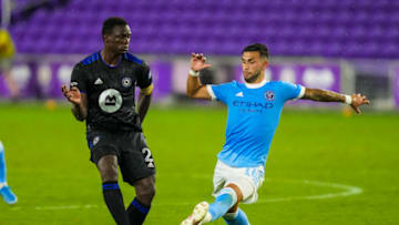 Jul 7, 2021; Orlando, Florida, USA; CF Montréal midfielder Victor Wanyama (2) passes the ball past New York City midfielder Valentin Castellanos (11) during the second half at Exploria Stadium. Mandatory Credit: Jasen Vinlove-USA TODAY Sports