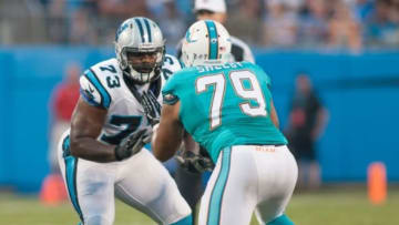 Aug 22, 2015; Charlotte, NC, USA; Carolina Panthers tackle Michael Oher (73) blocks Miami Dolphins defensive end Derrick Shelby (79) during the second quarter at Bank of America Stadium. Mandatory Credit: Jeremy Brevard-USA TODAY Sports