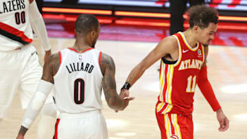 PORTLAND, OREGON - JANUARY 16: Damian Lillard #0 of the Portland Trail Blazers and Trae Young #11 of the Atlanta Hawks shake hands after the Blazers defeated the Hawks 112-106 at Moda Center on January 16, 2021 in Portland, Oregon. NOTE TO USER: User expressly acknowledges and agrees that, by downloading and or using this photograph, User is consenting to the terms and conditions of the Getty Images License Agreement. (Photo by Abbie Parr/Getty Images)