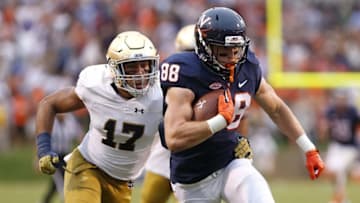Sep 12, 2015; Charlottesville, VA, USA; Virginia Cavaliers wide receiver Ryan Santoro (88) runs with the ball as Notre Dame Fighting Irish linebacker James Onwualu (17) chases in the fourth quarter at Scott Stadium. The Fighting Irish won 34-27. Mandatory Credit: Geoff Burke-USA TODAY Sports
