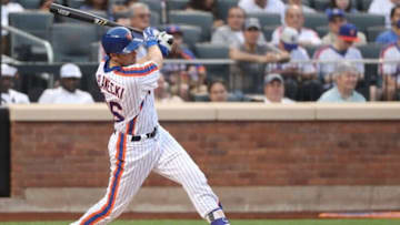 May 27, 2016; New York City, NY, USA; New York Mets catcher Kevin Plawecki (26) singles to right during the first inning against the Los Angeles Dodgers at Citi Field. Mandatory Credit: Anthony Gruppuso-USA TODAY Sports