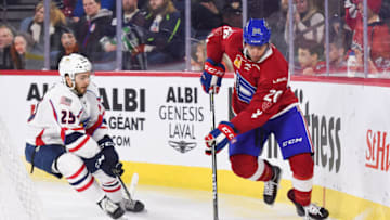 LAVAL, QC - APRIL 06: Laval Rocket defenceman Trevor Owens (20) gains control of the puck behind the net during the Springfield Thunderbirds versus the Laval Rocket game on April 6, 2018, at Place Bell in Laval, QC (Photo by David Kirouac/Icon Sportswire via Getty Images)