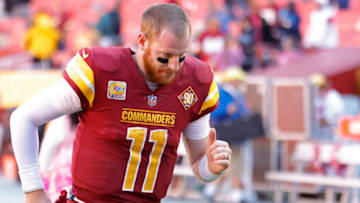 Oct 9, 2022; Landover, Maryland, USA; Washington Commanders quarterback Carson Wentz (11) jogs off the field after the Commanders' game against the Tennessee Titans at FedExField. Mandatory Credit: Geoff Burke-USA TODAY Sports