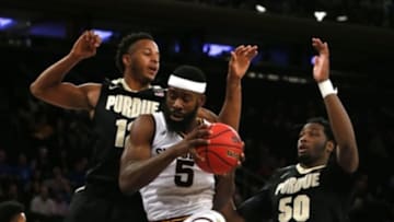 Dec 6, 2016; New York, NY, USA; Arizona State Sun Devils forward Obinna Oleka (5) grabs a rebound against Purdue Boilermakers forward Vince Edwards (12) and forward Caleb Swanigan (50) during second half at Madison Square Garden. Mandatory Credit: Noah K. Murray-USA TODAY Sports