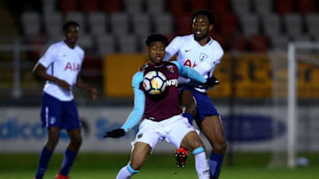 DAGENHAM, ENGLAND - FEBRUARY 12: Mal Hector-Ingram of West Ham tackles with Christian Maghoma of Tottenham during the Premier League 2 match between West Ham United and Tottenham Hotspur at Chigwell Construction Stadium on February 12, 2018 in Dagenham, England. (Photo by Jordan Mansfield/Getty Images)