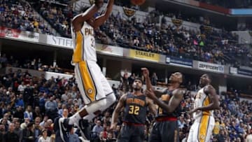 Jan 28, 2016; Indianapolis, IN, USA; Indiana Pacers center Myles Turner (33) dunks against Atlanta Hawks forward Mike Scott (32) at Bankers Life Fieldhouse. Indiana defeats Atlanta 111-92. Mandatory Credit: Brian Spurlock-USA TODAY Sports