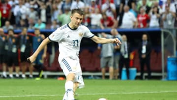 MOSCOW, RUSSIA - JULY 01: Aleksandr Golovin of Russia scores his team's third penalty in the penalty shoot out during the 2018 FIFA World Cup Russia Round of 16 match between Spain and Russia at Luzhniki Stadium on July 1, 2018 in Moscow, Russia. (Photo by Ryan Pierse/Getty Images)
