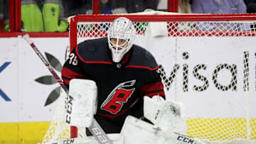 RALEIGH, NC - MARCH 16: Curtis McElhinney #35 of the Carolina Hurricanes crouches in the crease to protect the net during an NHL game against the Buffalo Sabres on March 16, 2019 at PNC Arena in Raleigh, North Carolina. (Photo by Gregg Forwerck/NHLI via Getty Images)