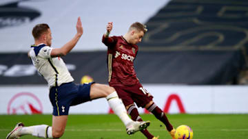 LONDON, ENGLAND - JANUARY 02: Ezgjan Alioski of Leeds United takes a shot with Toby Alderweireld of Tottenham Hotspur attempting to. (Photo by Ian Walton - Pool/Getty Images)