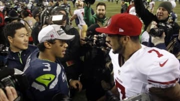 Jan 19, 2014; Seattle, WA, USA; Seattle Seahawks quarterback Russell Wilson (3) greets San Francisco 49ers quarterback Colin Kaepernick (7) after the 2013 NFC Championship football game at CenturyLink Field. Mandatory Credit: Joe Nicholson-USA TODAY Sports