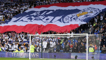 CARDIFF, WALES - NOVEMBER 03: Leicester City fans commemorate Vichai Srivaddhanaprabha by holding up scarfs and signs during the Premier League match between Cardiff City and Leicester City at Cardiff City Stadium on November 03, 2018 in Cardiff, United Kingdom. (Photo by Richard Heathcote/Getty Images)