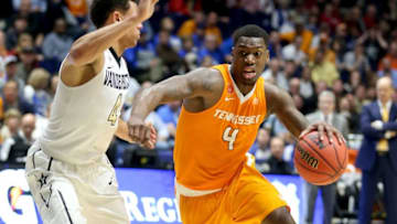 NASHVILLE, TN - MARCH 10: Armani Moore #4 of the Tennessee Volunteers dribbles the ball during the 67-65 win over the Vanderbilt Commodores during the second round of the SEC Basketball Tournament at Bridgestone Arena on March 10, 2016 in Nashville, Tennessee. (Photo by Andy Lyons/Getty Images)