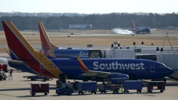 BALTIMORE, MARYLAND - DECEMBER 22: Southwest Airlines aircrafts are seen at Baltimore/Washington International Thurgood Marshall Airport (BWI) on December 22, 2021 in Baltimore, Maryland. AAA predicted more than 109 million Americans will travel 50 miles or more over Christmas and New Year holidays, a spike of 27.7% over last year. (Photo by Alex Wong/Getty Images)