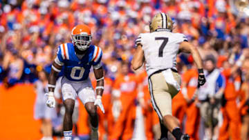 GAINESVILLE, FLORIDA - OCTOBER 09: Trey Dean III #0 of the Florida Gators looks on against Cam Johnson #7 of the Vanderbilt Commodores during the second half of a game at Ben Hill Griffin Stadium on October 09, 2021 in Gainesville, Florida. (Photo by James Gilbert/Getty Images)