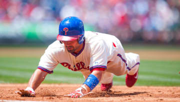 PHILADELPHIA, PA - JUNE 07: Shane Victorino #8 of the Philadelphia Phillies dives back into first base during the game against the Los Angeles Dodgers at Citizens Bank Park on Thursday, June 7, 2012 in Philadelphia, Pennsylvania. The Dodgers won the game 8-3. (Photo by Rob Tringali/MLB Photos via Getty Images)