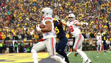 ANN ARBOR, MICHIGAN - NOVEMBER 27: TreVeyon Henderson #32 of the Ohio State Buckeyes carries the ball for a touchdown in the second half of the game against the Michigan Wolverines at Michigan Stadium on November 27, 2021 in Ann Arbor, Michigan. (Photo by Mike Mulholland/Getty Images)