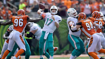 CINCINNATI, OH - OCTOBER 7: Carlos Dunlap #96 of the Cincinnati Bengals gets a hand on Ryan Tannehill #17 of the Miami Dolphins as he is attempting to throw the ball during the first quarter at Paul Brown Stadium on October 7, 2018 in Cincinnati, Ohio. (Photo by Bobby Ellis/Getty Images)