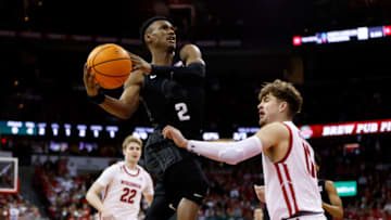 MADISON, WISCONSIN - JANUARY 10: Tyson Walker #2 of the Michigan State Spartans drives to the basket on Max Klesmit #11 of the Wisconsin Badgers during the first half at Kohl Center on January 10, 2023 in Madison, Wisconsin. (Photo by John Fisher/Getty Images)