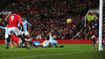 MANCHESTER, ENGLAND - DECEMBER 10: Nicolas Otamendi of Manchester City scores the 2nd Manchester City goal during the Premier League match between Manchester United and Manchester City at Old Trafford on December 10, 2017 in Manchester, England. (Photo by Michael Steele/Getty Images)