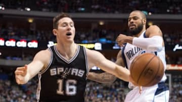 Dec 20, 2014; Dallas, TX, USA; San Antonio Spurs forward Aron Baynes (16) loses the ball in front of Dallas Mavericks center Tyson Chandler (6) during the first quarter at American Airlines Center. Mandatory Credit: Jerome Miron-USA TODAY Sports