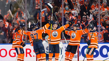 EDMONTON, AB - OCTOBER 13: Jesse Puljujarvi #13 of the Edmonton Oilers celebrates a goal against the Vancouver Canucks with teammates Darnell Nurse #25, Connor McDavid #97, Leon Draisaitl #29 and Tyson Barrie #22 during the first period at Rogers Place on October 13, 2021 in Edmonton, Canada. (Photo by Codie McLachlan/Getty Images)