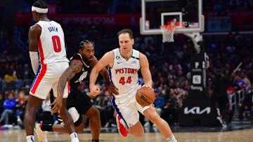 Detroit Pistons forward Bojan Bogdanovic (44) moves the ball as center Jalen Duren (0) provides coverage Credit: Gary A. Vasquez-USA TODAY Sports