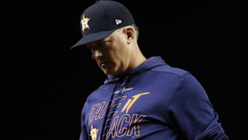 WASHINGTON, DC - OCTOBER 27: AJ Hinch #14 of the Houston Astros returns to the dugout after a mound visit against the Washington Nationals during the seventh inning in Game Five of the 2019 World Series at Nationals Park on October 27, 2019 in Washington, DC. (Photo by Patrick Smith/Getty Images)