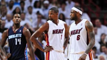 Apr 20, 2014; Miami, FL, USA; Miami Heat center Chris Bosh (left) talks with Miami Heat forward LeBron James (right) against the Charlotte Bobcats during the second half in game one during the first round of the 2014 NBA Playoffs at American Airlines Arena. The Heat won 99-88. Mandatory Credit: Steve Mitchell-USA TODAY Sports