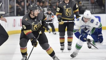 LAS VEGAS, NV - FEBRUARY 23: Colin Miller #6 of the Vegas Golden Knights skates with the puck while Bo Horvat #53 of the Vancouver Canucks defends during the game at T-Mobile Arena on February 23, 2018 in Las Vegas, Nevada. (Photo by David Becker/NHLI via Getty Images)