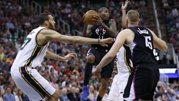 Apr 8, 2016; Salt Lake City, UT, USA; Los Angeles Clippers guard Jamal Crawford (11) looks to pass against Utah Jazz center Rudy Gobert (27) and guard Rodney Hood (5) in the second quarter at Vivint Smart Home Arena. Mandatory Credit: Jeff Swinger-USA TODAY Sports