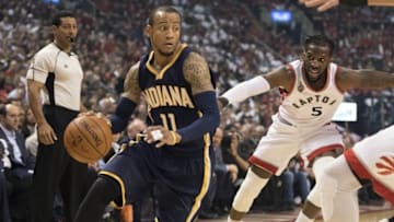 Apr 26, 2016; Toronto, Ontario, CAN; Indiana Pacers guard Monta Ellis (11) drives to the basket as Toronto Raptors forward DeMarre Carroll (5) tries to defend during the first quarter in game five of the first round of the 2016 NBA Playoffs at Air Canada Centre. Mandatory Credit: Nick Turchiaro-USA TODAY Sports