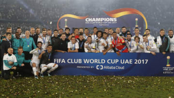 ABU DHABI, UNITED ARAB EMIRATES - DECEMBER 16: Players of Real Madrid pose with the trophy after the FIFA Club World Cup UAE 2017 Final match between Real Madrid CF and Gremio FBPA at Zayed Sports City Stadium on December 16, 2017 in Abu Dhabi, United Arab Emirates. (Photo by Angel Martinez/Real Madrid via Getty Images)