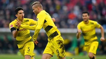 Dortmund's Ukrainian midfielder Andrej Jarmolenko celebrates scoring with Dortmund's Spanish defender Marc Bartra (L) during the German First division Bundesliga football match Hanover 96 vs Borussia Dortmund in Hanover, Germany, on October 28, 2017. / AFP PHOTO / PATRIK STOLLARZ / RESTRICTIONS: DURING MATCH TIME: DFL RULES TO LIMIT THE ONLINE USAGE TO 15 PICTURES PER MATCH AND FORBID IMAGE SEQUENCES TO SIMULATE VIDEO. == RESTRICTED TO EDITORIAL USE == FOR FURTHER QUERIES PLEASE CONTACT DFL DIRECTLY AT 49 69 650050 / RESTRICTIONS: DURING MATCH TIME: DFL RULES TO LIMIT THE ONLINE USAGE TO 15 PICTURES PER MATCH AND FORBID IMAGE SEQUENCES TO SIMULATE VIDEO. == RESTRICTED TO EDITORIAL USE == FOR FURTHER QUERIES PLEASE CONTACT DFL DIRECTLY AT 49 69 650050 (Photo credit should read PATRIK STOLLARZ/AFP/Getty Images)