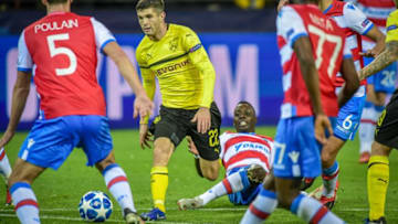 DORTMUND, GERMANY - NOVEMBER 28: Christian Pulisic of Dortmund and Stefano Denswil of Bruegge battle for the ball during the Group A match of the UEFA Champions League between Borussia Dortmund and Club Brugge at Signal Iduna Park on November 28, 2018 in Dortmund, Germany. (Photo by TF-Images/TF-Images via Getty Images)