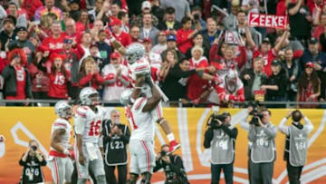 Jan 1, 2016; Glendale, AZ, USA; Ohio State Buckeyes running back Ezekiel Elliott (15) celebrates after a touchdown in the first quarter against the Notre Dame Fighting Irish in the 2016 Fiesta Bowl at University of Phoenix Stadium. Mandatory Credit: Matt Cashore-USA TODAY Sports