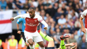 LONDON, ENGLAND - AUGUST 12: Alex Lacazette of Arsenal breaks past Ilkay Gundogan of Man City during the Premier League match between Arsenal FC and Manchester City at Emirates Stadium on August 12, 2018 in London, United Kingdom. (Photo by Stuart MacFarlane/Arsenal FC via Getty Images)