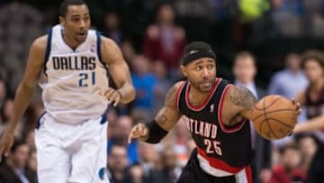 Jan 18, 2014; Dallas, TX, USA; Portland Trail Blazers point guard Mo Williams (25) steals the ball during the game against the Dallas Mavericks at the American Airlines Center. The Trail Blazers defeated the Mavericks 127-111. Mandatory Credit: Jerome Miron-USA TODAY Sports