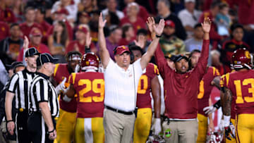 LOS ANGELES, CA - SEPTEMBER 21: Head coach Clay Helton of the USC Trojans calls for a touchdown during a video review late in the second quarter against the Washington State Cougars at Los Angeles Memorial Coliseum on September 21, 2018 in Los Angeles, California. (Photo by Harry How/Getty Images)