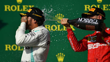 BUDAPEST, HUNGARY - AUGUST 04: Race winner Lewis Hamilton of Great Britain and Mercedes GP and third placed Sebastian Vettel of Germany and Ferrari celebrate on the podium during the F1 Grand Prix of Hungary at Hungaroring on August 04, 2019 in Budapest, Hungary. (Photo by Dan Mullan/Getty Images)